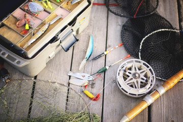 a set of fisherman on a wooden background © alexkich