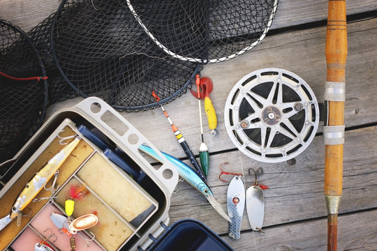 a set of fisherman on a wooden background