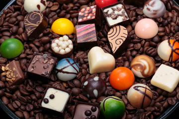 Set of a various chocolate pralines and coffee beans