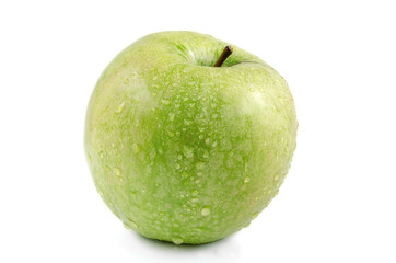 Green apple with water drops on a white background.