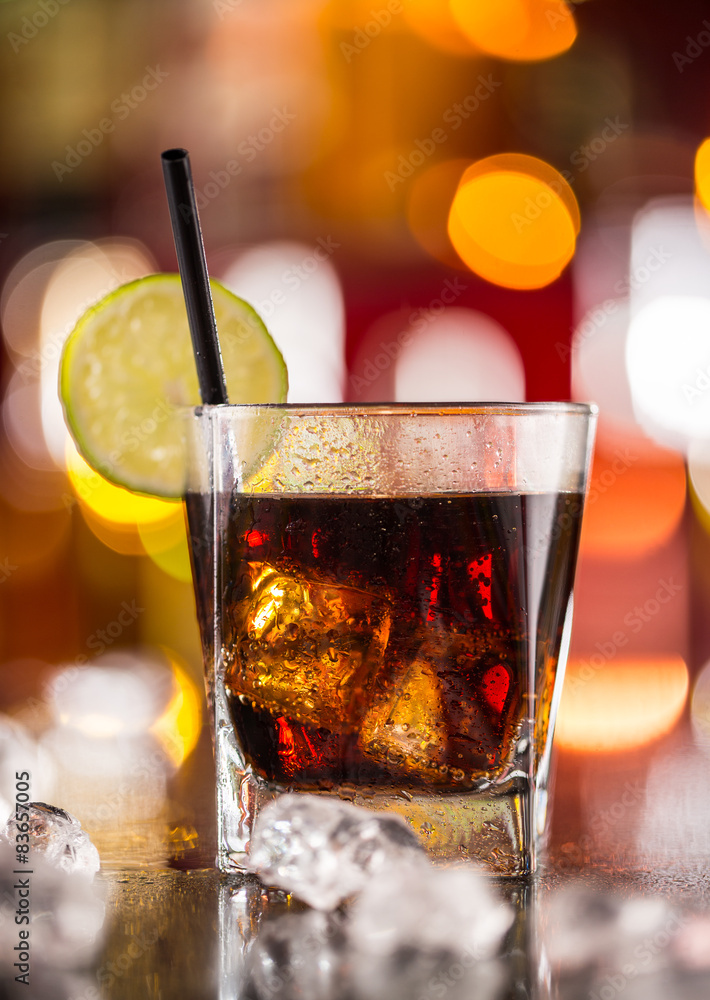 Wall mural glass of cola drink on bar counter