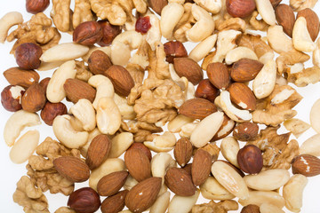 background of mixed nuts -  hazelnuts, walnuts, cashews,  pine nuts