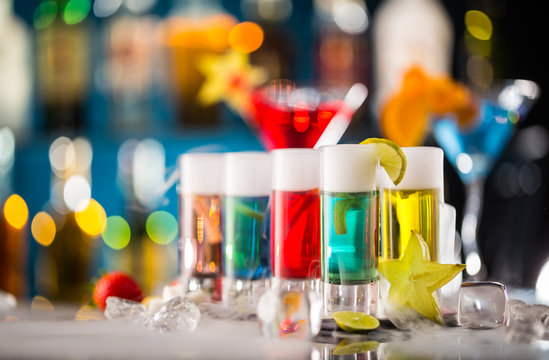 Variation of hard alcoholic shots on bar counter