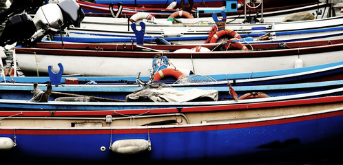 rowing boats and motor boats moored at the pier