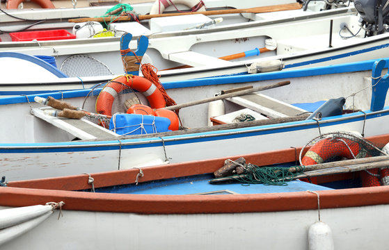 rowing boats and motor boats moored at the pier