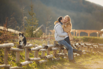 Loving young couple in autumn in the village.