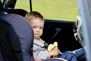  toddler boy in the car seat