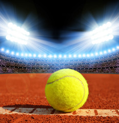 Tennis ball on a tennis clay court