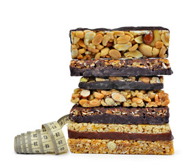 Chocolate Muesli Bars with measuring tape isolated 
