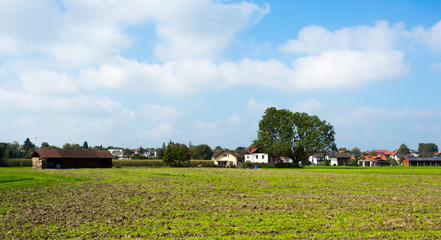 Obraz premium Bright green meadows and blue sky