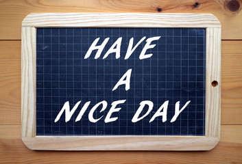 Have a Nice Day in white text on a slate blackboard