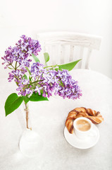 Cup of coffee and Lilac Bouquet
