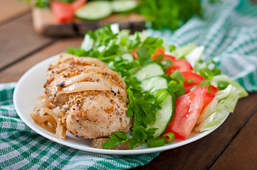 Baked chicken breast and fresh vegetables 