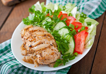Baked chicken breast and fresh vegetables 