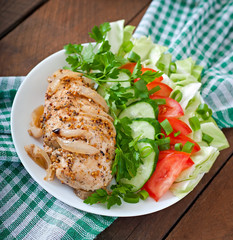 Baked chicken breast and fresh vegetables 