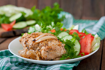 Baked chicken breast and fresh vegetables 