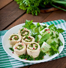 Steamed chicken rolls with greens and fresh vegetable salad