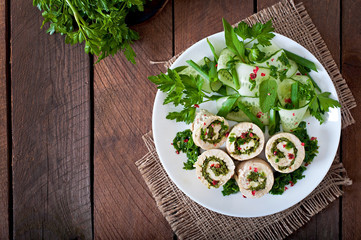 Steamed chicken rolls with greens and fresh vegetable salad
