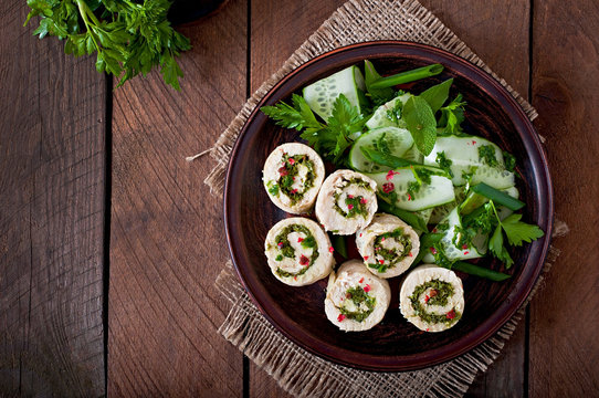 Steamed chicken rolls with greens and fresh vegetable salad