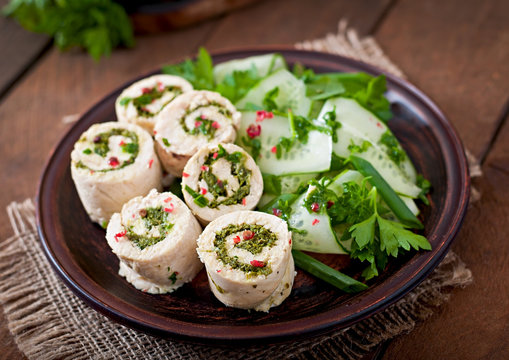 Steamed chicken rolls with greens and fresh vegetable salad