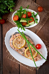 Baked salmon steak with lemon and herbs