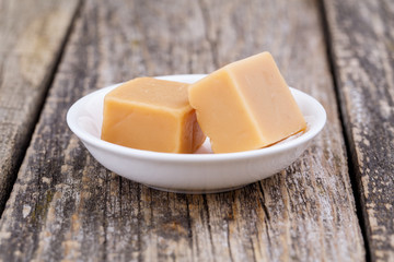 Tasty toffees on a white background.