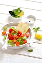 fresh tomatoes and cheese on a vintage plate 