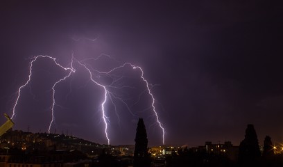 Naklejka na ściany i meble Lightnings in the nigh sky in Genoa (Italy)