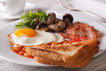 English breakfast: fried eggs with bacon and vegetables 

