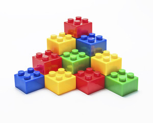 Colorful stacked toy building blocks.