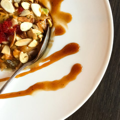 Dish with eel, avocado and sliced almonds