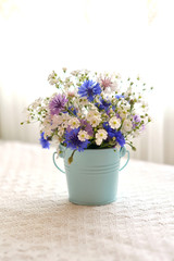 wild flowers in a bucket