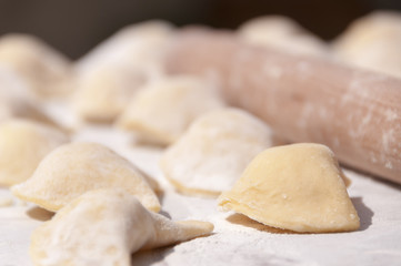 Fototapeta na wymiar Making traditional food pierogy with dough roller
