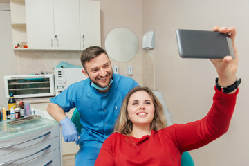 Patients and dentist doing a self portrait
