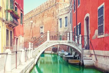 Fototapeta na wymiar Small bridge over a canal in Venice, Italy.