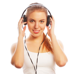 Woman with headphones listening music . 