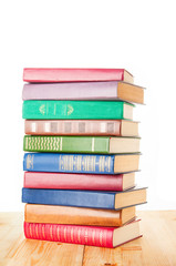 Old colorful books on white background