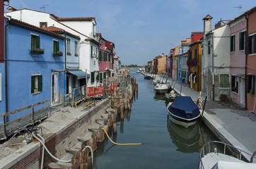 Fototapeta na wymiar Water street repair in Burano island, near Venice, Italy 