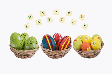 Easter eggs with a happy wishes on white background .