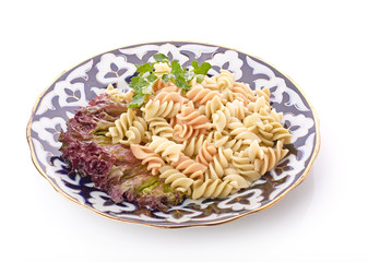 Penne pasta with sauce, cheese and basil, selective focus