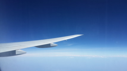Plane's wing in the air