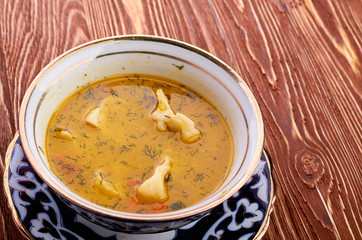 Bowl of chicken soup with vegetables and noodles