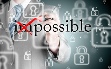 Businessman Hand turning the word Impossible into Possible with