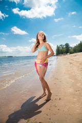 Portrait of merry little girl posing at camera