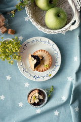Blueberry tart set with apples and sugar, overview