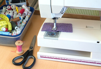 Electric sewing machine and sewing accessories closeup