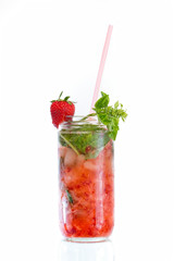 red cocktail with strawberry and straw over white background