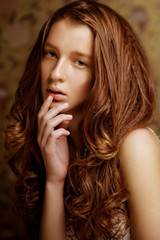 young woman with long curly hair