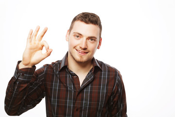 Fototapeta premium Handsome young man in shirt looking at camera 