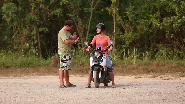 instructor explains best way of scooter balance to girl